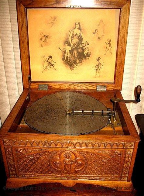 carved wood music box with metal disks|Regina Music Box Center: Disc music box listings (Regina, .